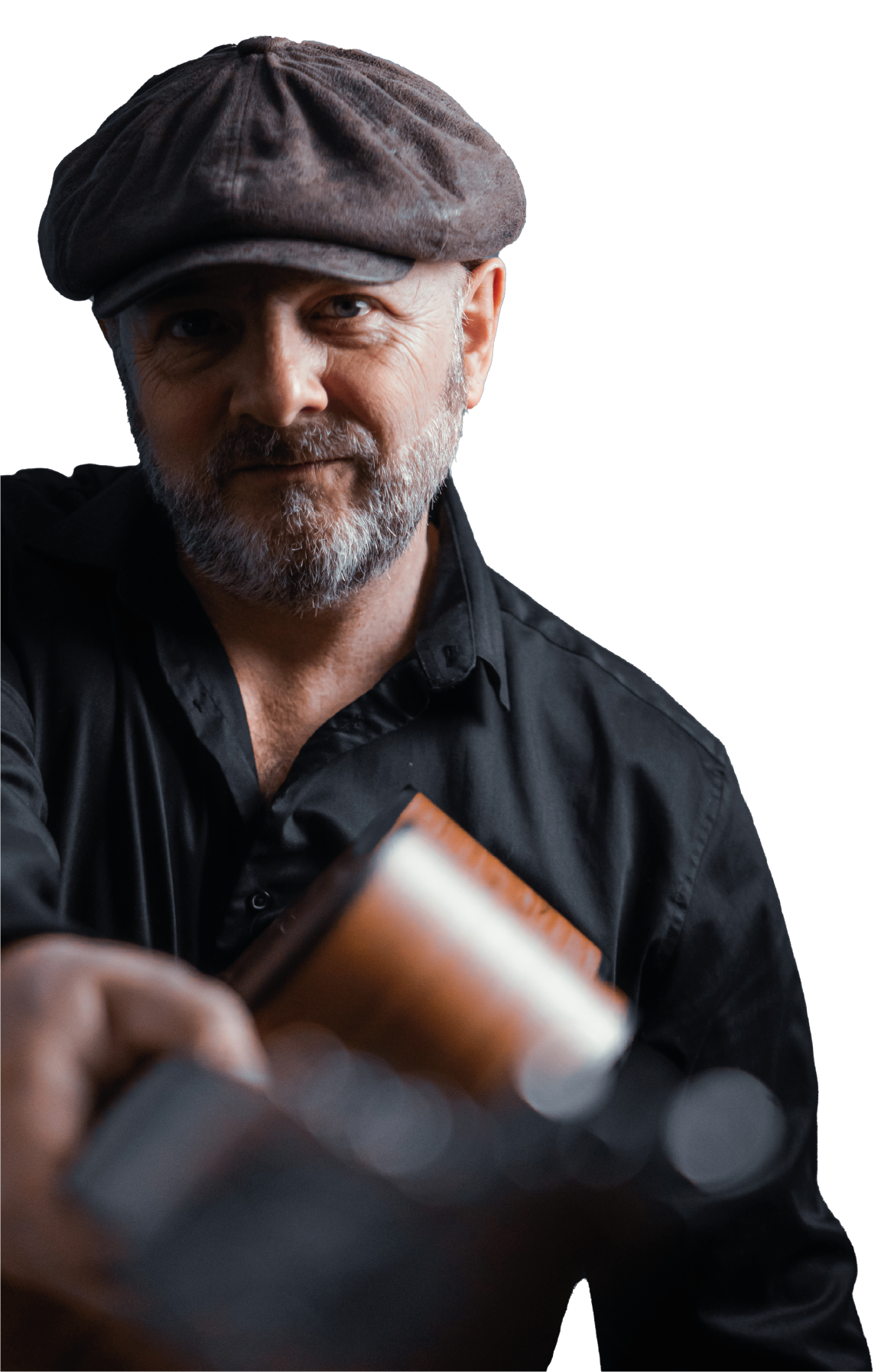 Wiggy in his flat cap, with his acoustic guitar